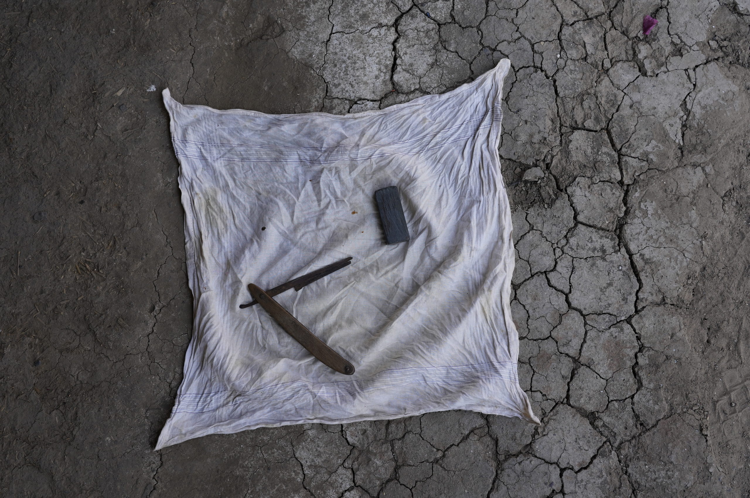 Razor and sharpening stone used by barber Narottam Valand to shave Gandhi, Rayma